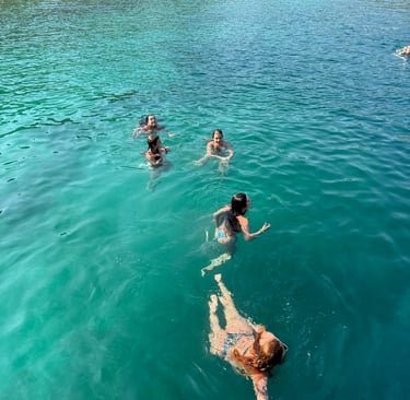 people swimming from boat tour Saranda