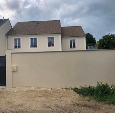a house with a trash canister and a trash canister