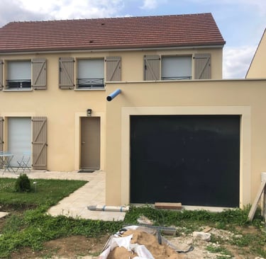 a house with a garage door and a garage door