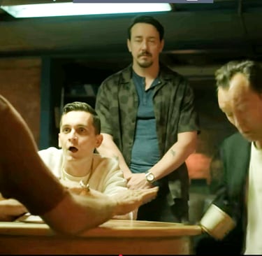 Law's character Jake getting a cup of coffee knocked into his lap on the series Black Rabbit