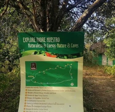 Map of Padre Nuestro nature and caves trail in a tropical forest setting near a green hut.