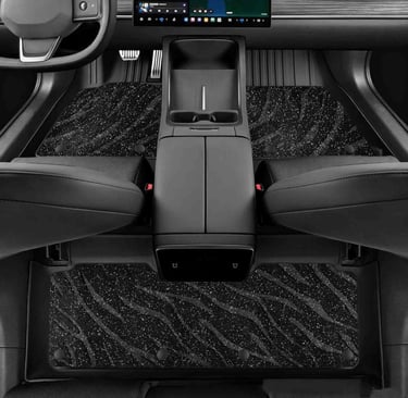 Custom black glitter car floor mats with silver tiger stripe pattern installed in a modern vehicle interior.