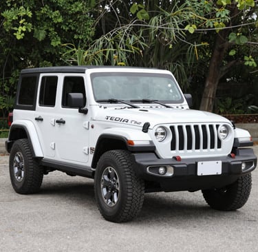 A sleek silver sedan parked by a sunny street in Golem, ready for a city drive.