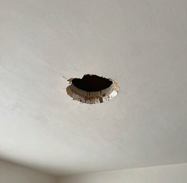 drywall ceiling with a hole