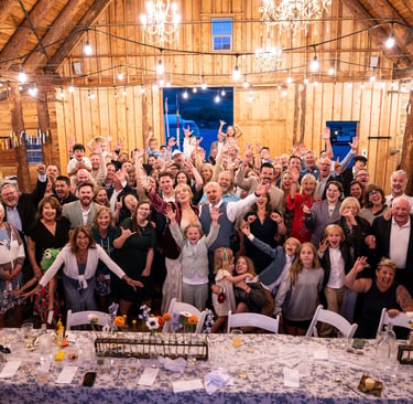 Friends and family at Wedding Reception in Barn