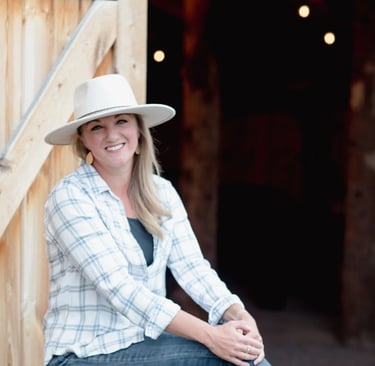 about - Christina sitting outside the barn