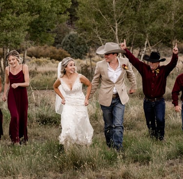 wedding party running outdoors