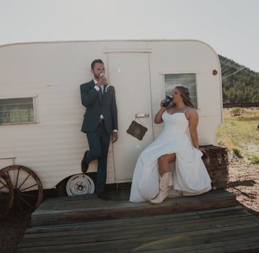 couple toasting in front of RV