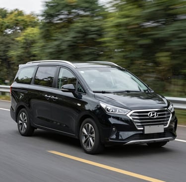 Close-up of the company logo 'رحلة مكة' displayed on the side of a white transport vehicle.