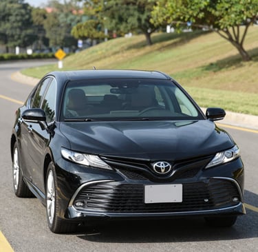 A serene view of the vehicle fleet lined up with the golden hues of sunset reflecting the spiritual journey.