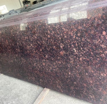 Polished Tan Brown granite slab with dark mahogany and black flecks for luxury kitchen countertops.