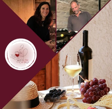 A photo of two people with La Vie en Rouge logo and a bottle of wine with grapes on a table