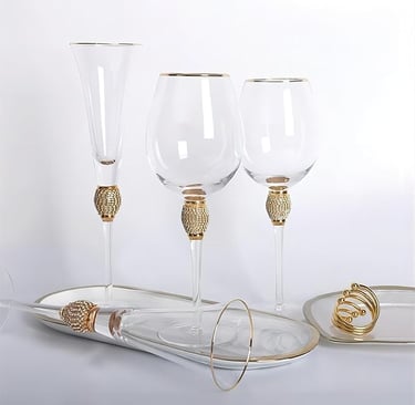 Set of four rhinestone gold-rim champagne flutes, luxury sparkling glassware.