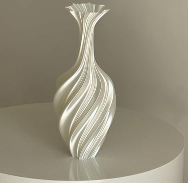Tall white decorative vase with elegant swirled design, luxury modern home decor.