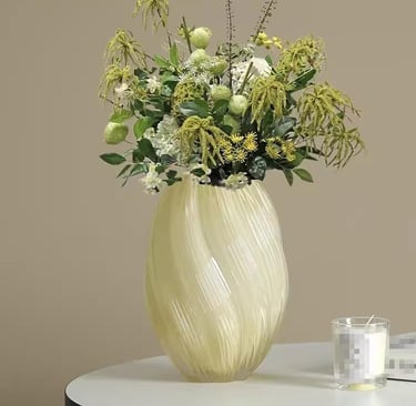 Large cream ceramic vase with green and white floral arrangement, luxury home decor.