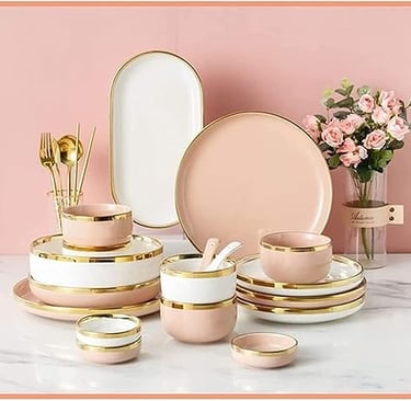 Blush pink ceramic dinner set with gold accents, stylish luxury tableware for elegant dining.