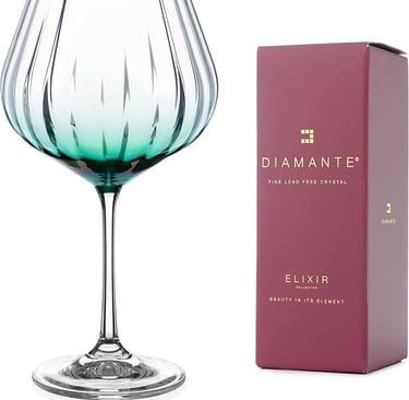 Tall green-tinted wine glass with gold rim, elegant luxury stemware.