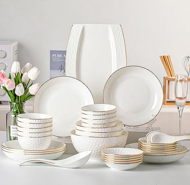 White porcelain dinner set with elegant gold rims, luxury tableware for modern dining.