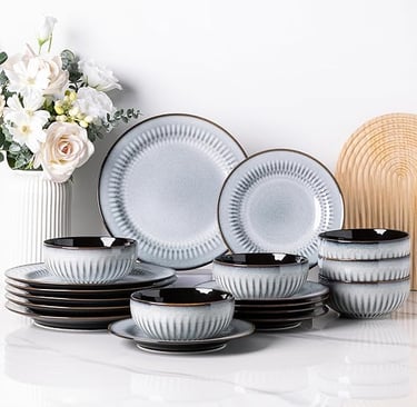 White stoneware dinner set with vertical ribbed texture, modern minimalist crockery.