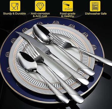 Silver hammered cutlery set styled on textured white dinner plates.