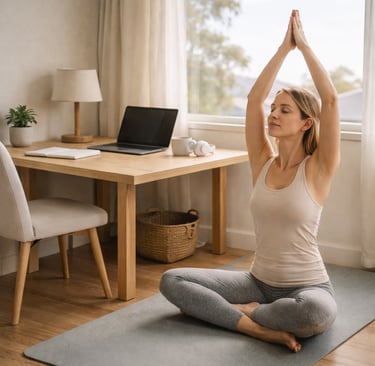 A woman practicing yoga and meditation on a mat in her home office to relieve work stress.