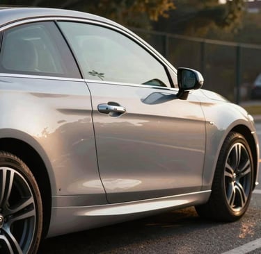 Before and after side-by-side shots of a car's exterior showing dramatic polish and shine.