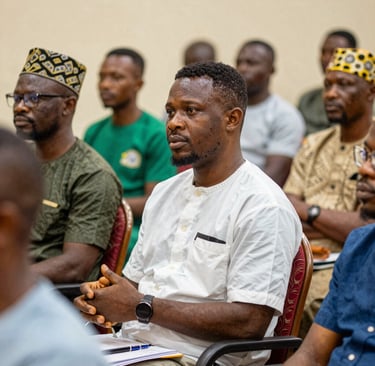 Diverse people building a foundation beneath a glowing document amidst city ruins and stone pillars.