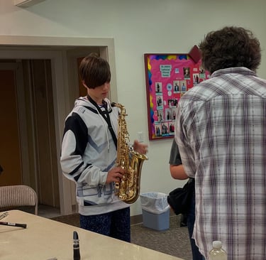 TAHB student checks out what the sax feels like