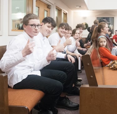 Students from TAHB watch & listen to their peers at a winter concert