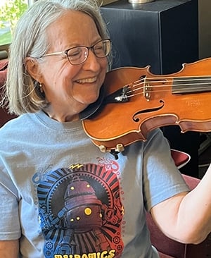 Talbotics t-shirt wearer playing violin in Massachusetts.