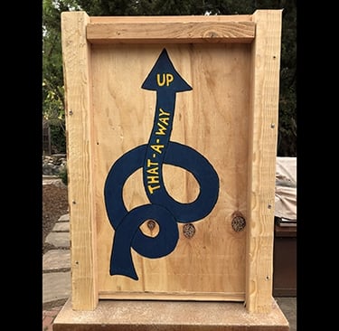 Shipping crate for Talbotics sculpture with image of squiggly arrow drawn on it.