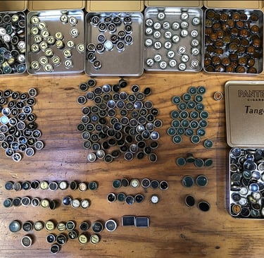 A large collection of many typewriter keys from different typewriters.