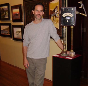 Tal Avitzur with robot sculpture in the Santa Barbara Natural History Museum 2011 group show.