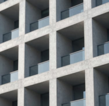 Close-up detail of a modern building facade featuring brutalist concrete textures and sharp geometric shadows. The lighting is soft morning sun, with a color palette of #CDDDE0 and #6E8898. High-end architectural photography style.