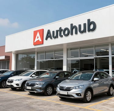 A welcoming reception desk inside Auto Hub Car Sales with a sleek dark interior and a friendly staff member ready to assist customers.