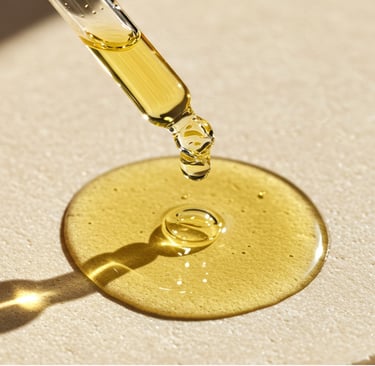 a drop of facial oil on a bathroom cabinet