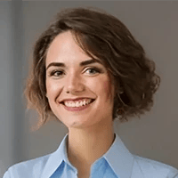 Smiling woman headshot in light blue shirt. Tech support testimonial from happy Cedar Rapids client.