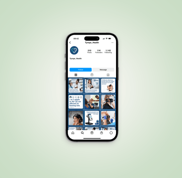 A phone displaying a photo of a person against a blue background.