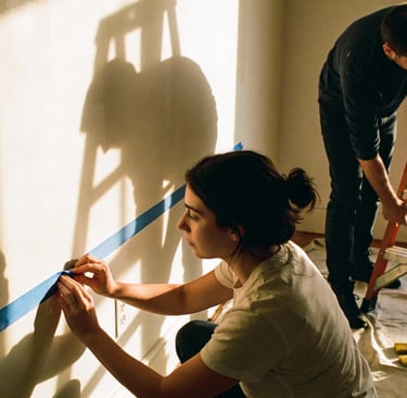 Couple is preparing their apartment for paintworks