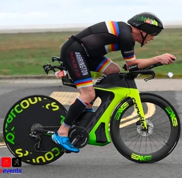 James Oswald Coaching in a triathlon competition riding a Cervélo PX5 with a Parcours rear wheel.