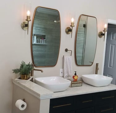 a bathroom with two sinks and mirrors