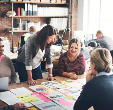 Diverse creative team collaborating on a marketing project in a modern open-plan office.