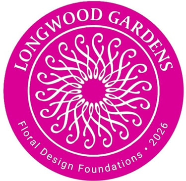 Pink circular logo for Longwood Gardens Floral Design Foundations 2026 with a white swirl pattern.