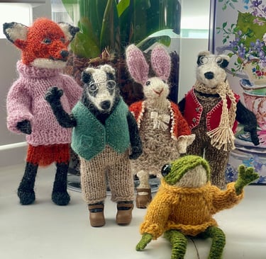 a group of knitted animals sitting on a counter