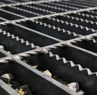 a metal grate with a metal grate and a metal grate