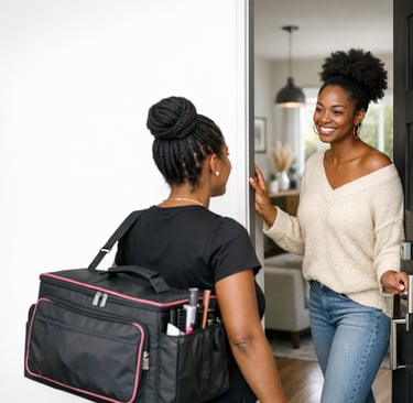 A smiling woman greets a professional hairstylist at the door for an at-home hair braiding service.