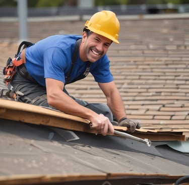 Smiling professional roofer in a yellow hard hat installing asphalt shingles on a residential roof.