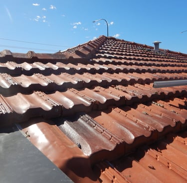 Building maintenance on Perth tiled roof