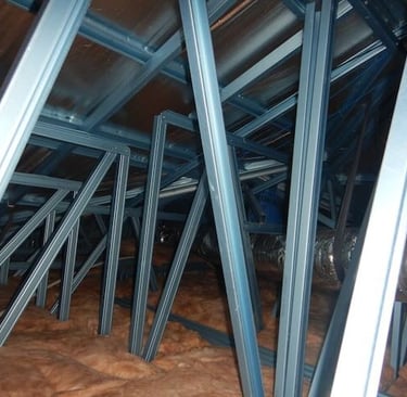 Roof maintenance occurring on Perth property with steel trusses. 