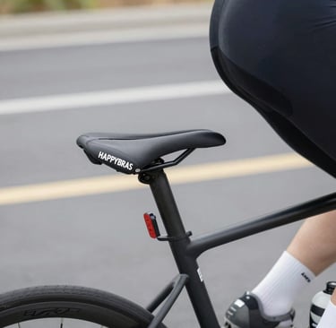 Close-up of a sleek, modern bike handlebar with the happybras logo subtly engraved